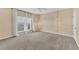 Bright bedroom with carpeted floor, large window, and ceiling fan at 3929 Cape Haze Dr # 105, Rotonda West, FL 33947