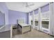 Charming bedroom with light purple walls and large window at 3929 Cape Haze Dr # 105, Rotonda West, FL 33947