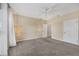 Bedroom with carpet, ceiling fan, and hanging lights at 3929 Cape Haze Dr # 105, Rotonda West, FL 33947