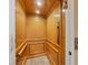 Wood-paneled elevator with carpeted floor at 3929 Cape Haze Dr # 105, Rotonda West, FL 33947