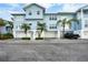 Front view of light blue townhouse with attached garage at 3929 Cape Haze Dr # 105, Rotonda West, FL 33947