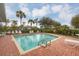 Inviting community pool with lounge chairs and patio area at 3929 Cape Haze Dr # 105, Rotonda West, FL 33947