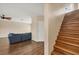 Staircase with wood railing and treads, leading to the upper level at 3929 Cape Haze Dr # 105, Rotonda West, FL 33947