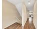 Stairway with wood-look flooring and neutral walls at 3929 Cape Haze Dr # 105, Rotonda West, FL 33947
