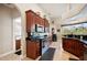 Kitchen with dark wood cabinets and granite counters at 41 Robina St, Port Charlotte, FL 33954