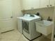 Laundry room with washer, dryer, and utility sink at 5160 Farewell St, Port Charlotte, FL 33981