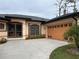 Exterior view of a single-story house with a two car garage at 5160 Farewell St, Port Charlotte, FL 33981