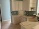 Modern kitchen featuring white cabinets and tile at 5160 Farewell St, Port Charlotte, FL 33981