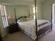 Main bedroom with a large bed and wooden nightstands at 5160 Farewell St, Port Charlotte, FL 33981