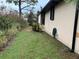 Rear view of a single story home with a side yard at 5160 Farewell St, Port Charlotte, FL 33981