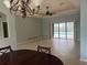 Spacious dining room with pool view and chandelier at 5160 Farewell St, Port Charlotte, FL 33981