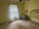 Bedroom with carpet flooring, window, and gold headboard at 5160 Farewell St, Port Charlotte, FL 33981