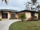 Single story home with attached garage and attractive curb appeal at 5160 Farewell St, Port Charlotte, FL 33981