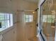 Clean bathroom with shower, tile flooring, and a large mirror at 5160 Farewell St, Port Charlotte, FL 33981