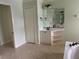 Bathroom with a large vanity, linen closet, and tile floor at 5160 Farewell St, Port Charlotte, FL 33981