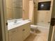Bathroom with tub, white vanity, and a large mirror at 5160 Farewell St, Port Charlotte, FL 33981