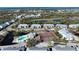 Aerial view of community, pool, and tennis courts at 6800 Placida Rd # 192, Englewood, FL 34224