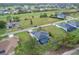 Aerial view showcasing a home with a pool in a residential neighborhood at 71 Pine Valley Pl, Rotonda West, FL 33947