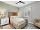 Bright bedroom with a comfortable bed and plenty of natural light at 71 Pine Valley Pl, Rotonda West, FL 33947