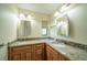 Double vanity bathroom with granite countertops at 9381 St Paul Dr, Port Charlotte, FL 33981