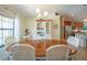 Bright dining room with a wooden table and white chairs at 9381 St Paul Dr, Port Charlotte, FL 33981