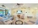 Bright and airy living room with comfortable seating and large TV at 9381 St Paul Dr, Port Charlotte, FL 33981