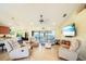 Bright living room with comfy seating and a large TV at 9381 St Paul Dr, Port Charlotte, FL 33981