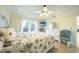 Spacious main bedroom with a king-size bed and access to the patio at 9381 St Paul Dr, Port Charlotte, FL 33981