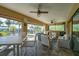 Covered patio with comfortable seating overlooking the pool at 9381 St Paul Dr, Port Charlotte, FL 33981