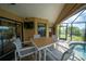 Covered patio with seating area and view of the pool at 9381 St Paul Dr, Port Charlotte, FL 33981
