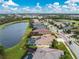 Aerial view of home's back, highlighting the pool and solar panels at 5100 White Ibis Dr, North Port, FL 34287