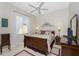 Spacious bedroom with a large bed, nightstands and dresser at 5100 White Ibis Dr, North Port, FL 34287