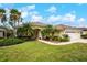 Single-story house with two palm trees in front at 5100 White Ibis Dr, North Port, FL 34287