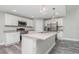 Modern kitchen with white cabinets, granite countertops, and stainless steel appliances at 450 Albatross Rd, Rotonda West, FL 33947