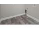 Laundry room with wood-look tile flooring and built-in cabinets at 450 Albatross Rd, Rotonda West, FL 33947