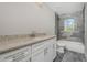 Bathroom boasts granite countertops and a modern bathtub at 450 Albatross Rd, Rotonda West, FL 33947