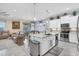 Open concept kitchen with stainless steel appliances and island at 10311 Lands End Cir # 13, Placida, FL 33946