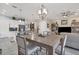 Bright dining area with a large table and chandelier at 10311 Lands End Cir # 13, Placida, FL 33946