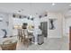 Modern kitchen with white cabinets and granite countertops at 10311 Lands End Cir # 13, Placida, FL 33946