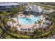 Community pool with surrounding lounge chairs and landscaping at 10311 Lands End Cir # 13, Placida, FL 33946