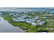 Aerial view showcasing the community's waterfront location and expansive layout at 10311 Lands End Cir # 13, Placida, FL 33946