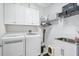 Laundry room with washer, dryer, cabinets, and sink at 10311 Lands End Cir # 13, Placida, FL 33946