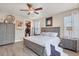Bright bedroom with king-size bed and access to a walk-in closet at 10311 Lands End Cir # 13, Placida, FL 33946