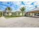 Community clubhouse with parking and tropical landscaping at 10311 Lands End Cir # 13, Placida, FL 33946