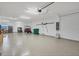 Spacious garage with ample storage space and golf cart at 10311 Lands End Cir # 13, Placida, FL 33946