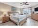 Bright and airy main bedroom with large window and wood floors at 10311 Lands End Cir # 13, Placida, FL 33946