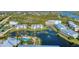 Aerial view of community with pool and tennis courts at 10311 Lands End Cir # 13, Placida, FL 33946
