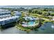 Aerial view of community, showcasing the clubhouse, pool, and waterfront location at 10311 Lands End Cir # 13, Placida, FL 33946