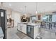 Modern kitchen with island and stainless steel appliances at 10311 Lands End Cir # 13, Placida, FL 33946