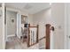 Upstairs hallway with home office and hardwood floors at 10311 Lands End Cir # 13, Placida, FL 33946